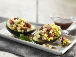 Avocado Corn Bean Salad served in Avocado on plates